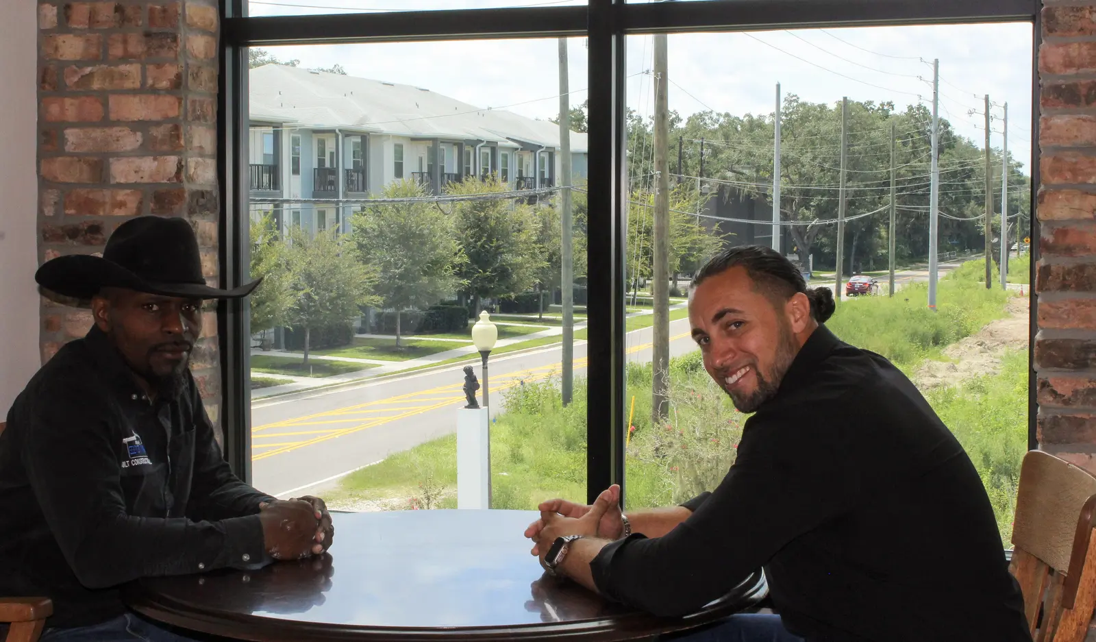 Mike and Josh reviewing construction plans together at the Bethel office