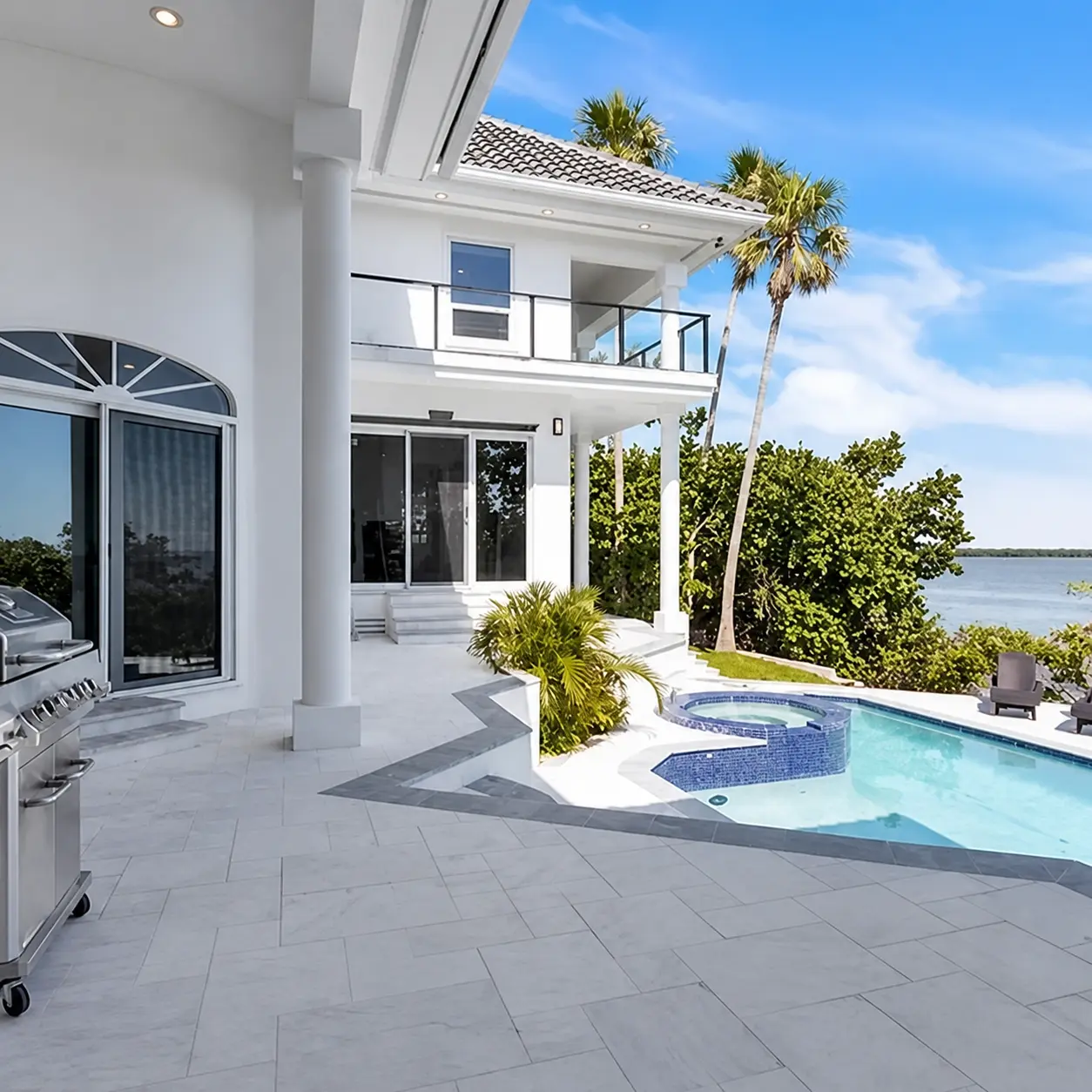 Waterfront outdoor living and pool area
